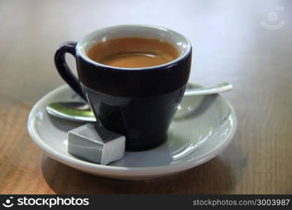 Fresh brewed espresso coffee in a small cup