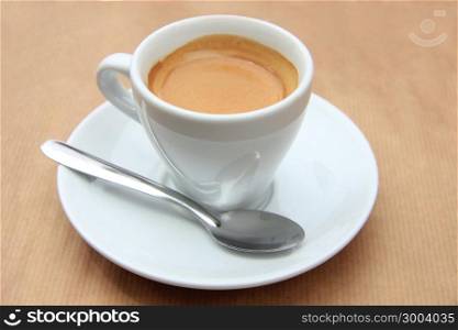 Fresh brewed espresso coffee in a white cup