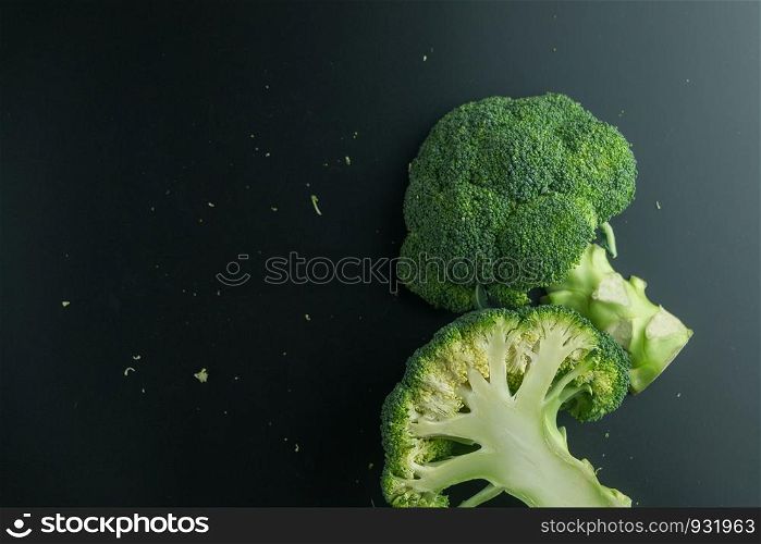 Fresh broccoli on black background. top view