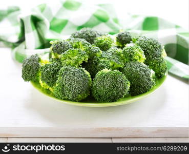 fresh broccoli on wooden table