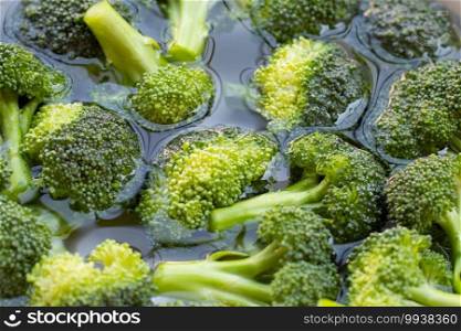 Fresh broccoli soaked in water