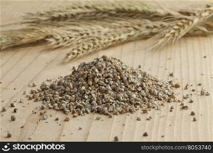 Fresh broken rye seeds and rye ears