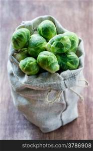 Fresh brussel sprouts on rustic background, selective focus