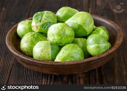 Fresh Brussels sprouts in the clay bowl
