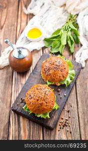 fresh burgers on a table, stock photo