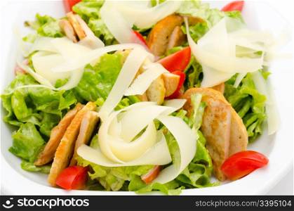 fresh Caesar salad with ham and tomatoes
