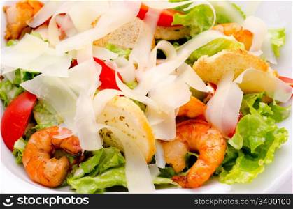 fresh Caesar salad with shrimps and tomatoes