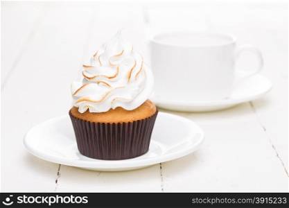 Fresh cake with white cream and a cup of air shot in high key. Fresh cake with white cream and a cup