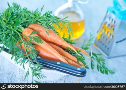fresh carrot and knife on a table