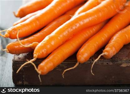 fresh carrot over wooden background