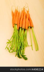 Fresh carrots on the wooden table