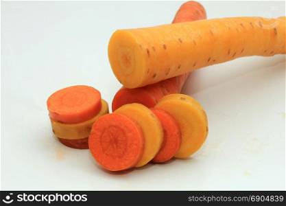 Fresh carrots, orange and yellow, cut in slices