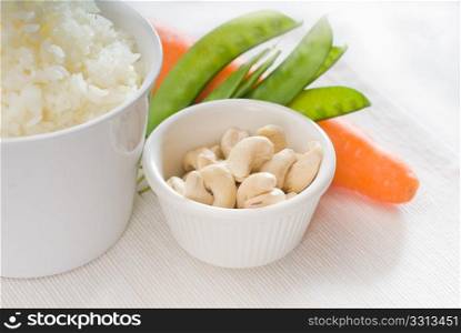 fresh cashew nut and vegetables,with steamed white rice ,typical ingredients of chinese cuisine
