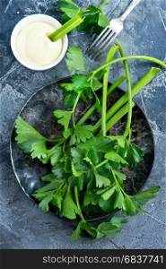 fresh celery and sauce in bowl, stock photo