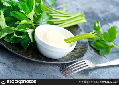 fresh celery and sauce in bowl, stock photo