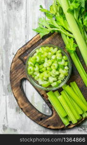 Fresh celery on a cutting Board. On wooden background. Fresh celery on a cutting Board.