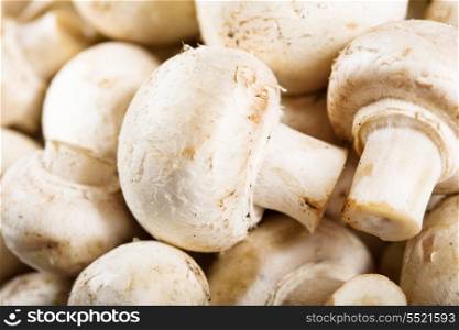 Fresh champignon mushrooms as background