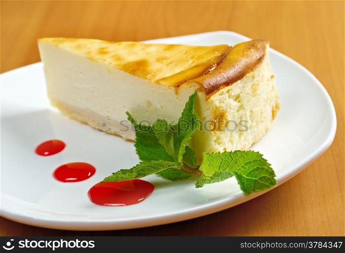 Fresh cheesecake with mint and topping