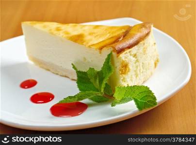 Fresh cheesecake with mint and topping