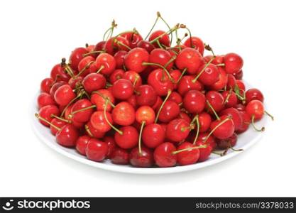 fresh cherries on a plate isolated on white