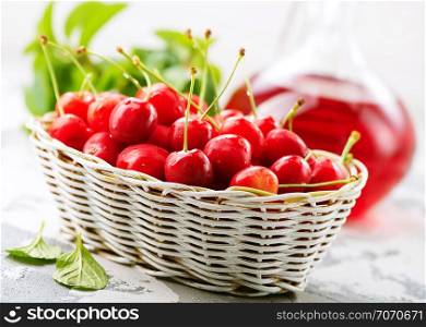 fresh cherry in basket and on a table