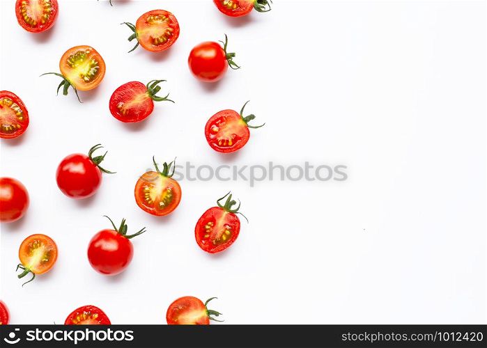 Fresh cherry tomatoes, whole and half cut isolated on white background. Copy space