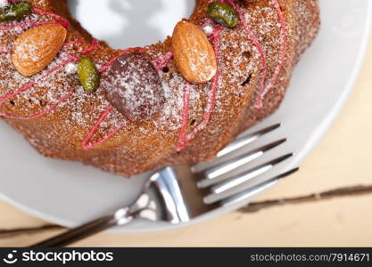 fresh chestnut cake bread dessert with almonds and pistachios on top