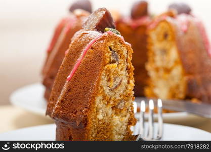 fresh chestnut cake bread dessert with almonds and pistachios on top