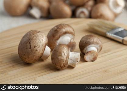 Fresh chestnut mushrooms on the cutting board