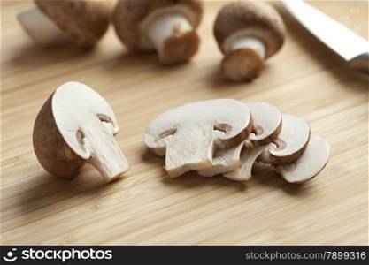 Fresh chestnut mushrooms slices on the cutting board