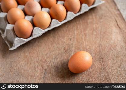 Fresh chicken eggs eggs in paper tray,egg carton on wooden background.