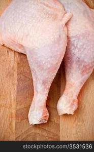 fresh chicken thighs laying on cutting board