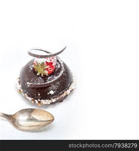 fresh chocolate strawberry mousse over white with silver spoon