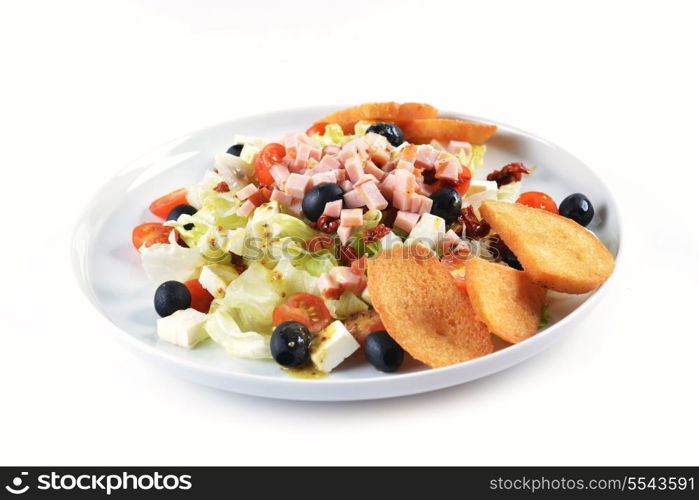 fresh chopped ham salad with cheese on white plate