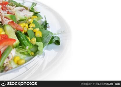 fresh chopped tuna salad with spinach on white plate