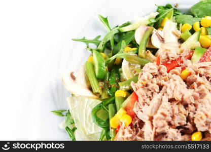 fresh chopped tuna salad with spinach on white plate