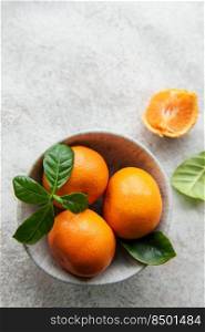 Fresh citrus fruits tangerines, oranges  on a concrete background