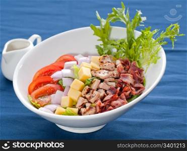 fresh classic caesar salad over blue tablecloth close up,healthy meal ,MORE DELICIOUS FOOD ON PORTFOLIO