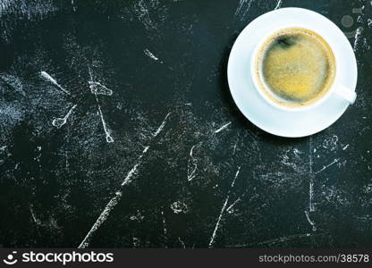 fresh coffee in cup and on a table