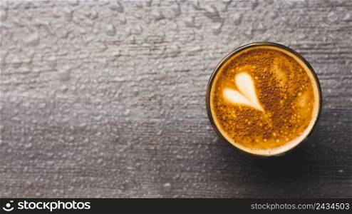 fresh coffee with heart latte art water drop backdrop