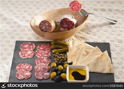 fresh cold cut platter with pita bread and pickles antipasti