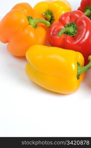 Fresh colorful bell peppers on white background