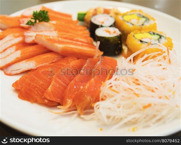 Fresh colorful Japanese food on the white plate, selective focused