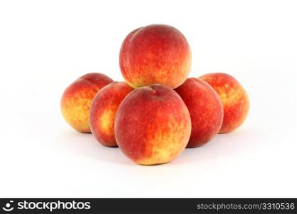 fresh colorful ripe peaches isolated on white