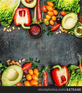 Fresh Colorful Vegetables ingredients for tasty vegan and healthy cooking or salad making on rustic background, top view, frame. Diet food concept.