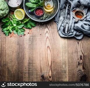 Fresh condiment and seasoning food setting on rustic kitchen table background, cooking preparation, top view, copy space