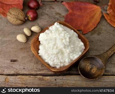 Fresh Cottage Cheese On Wooden Background, Close Up