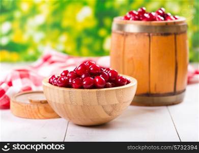 fresh cranberries on wooden table