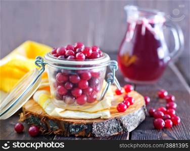 fresh cranberry in bowl and on a table
