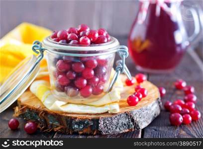 fresh cranberry in bowl and on a table